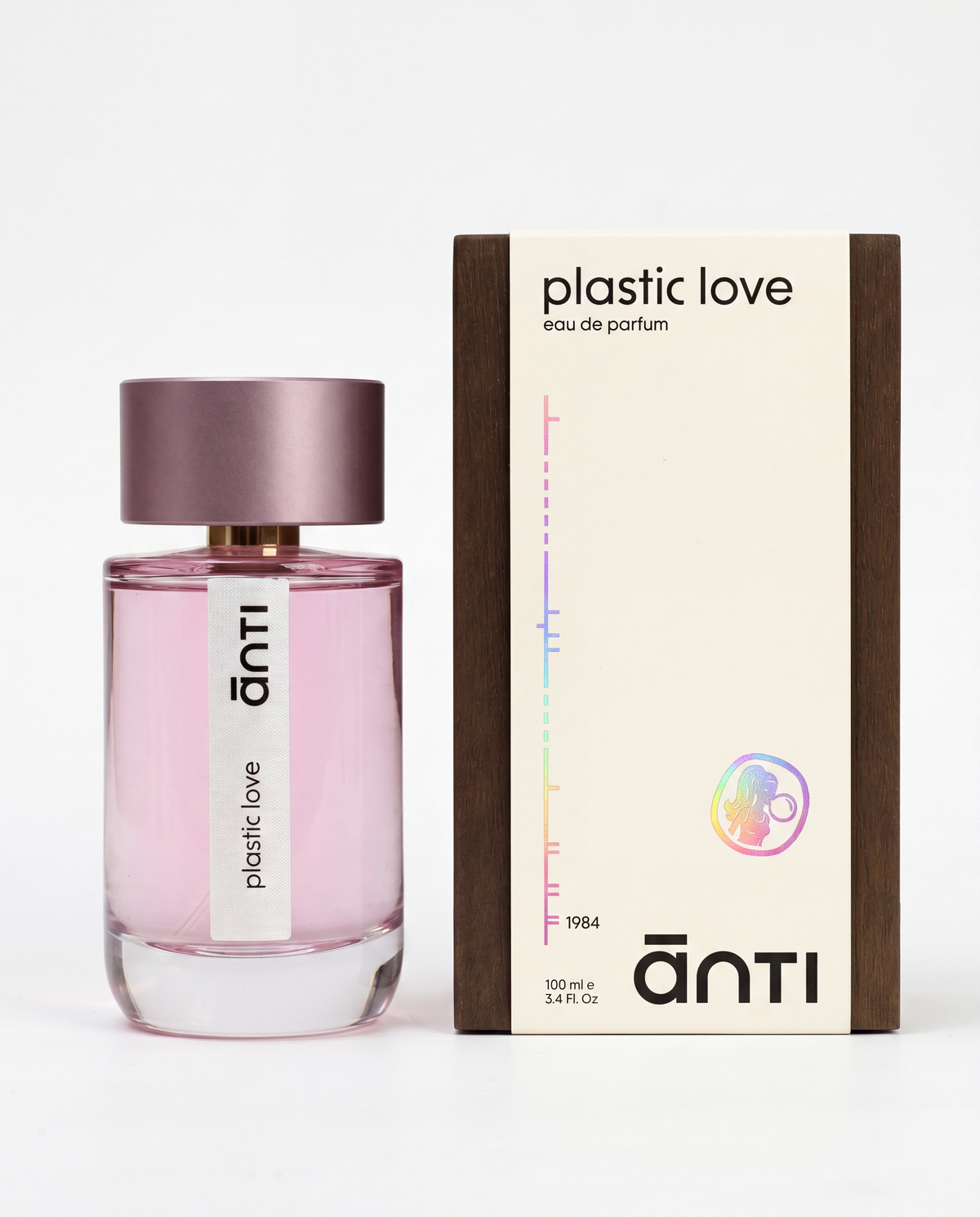 plastic love by ānti, the pink 100ml bottle beside its cream and dark wood eau de parfum box