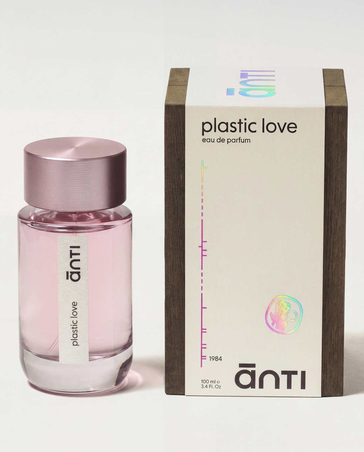 plastic love by ānti, the pink 100ml bottle beside its cream and dark wood box shown at an angle